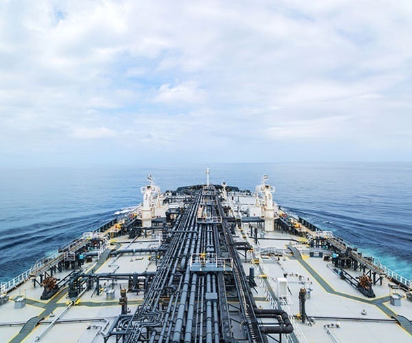 Large ship with pipework and deck covered in protective coatings