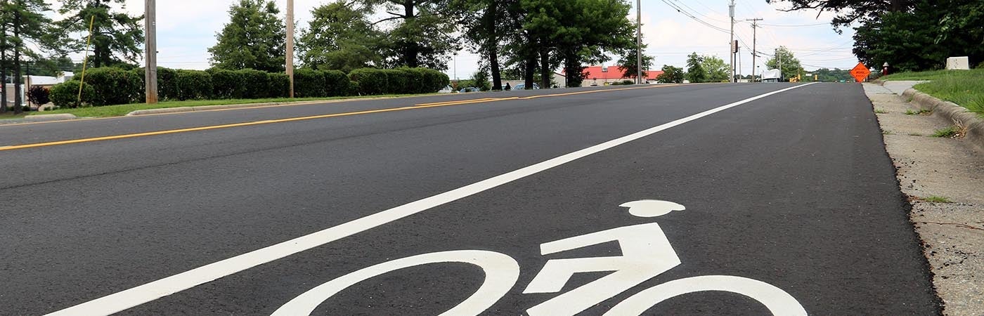 Bike lane markings on the side of a road