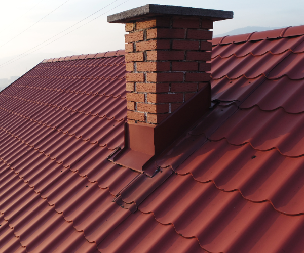 Red roof tiles with brick chimney