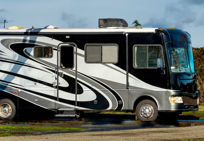 Recreational vehicle (RV) parked on grass