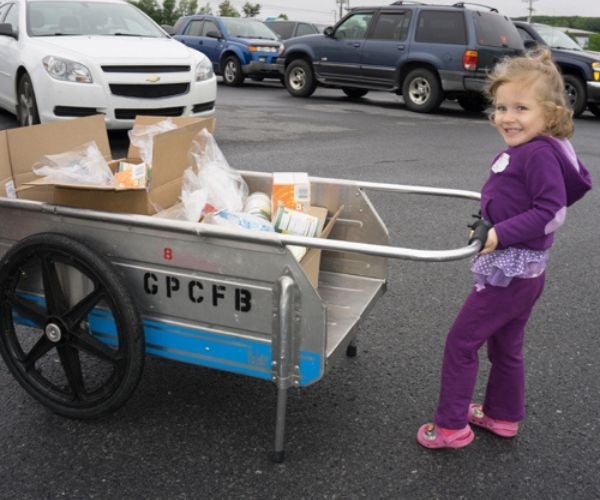 child pushing food cart