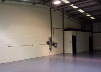 Large empty room inside a warehouse.