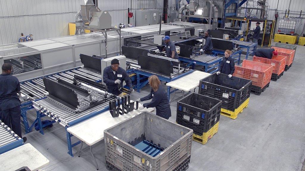 Several people working in a factory