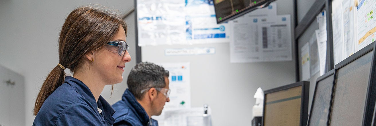 Male and female colleagues working on computers
