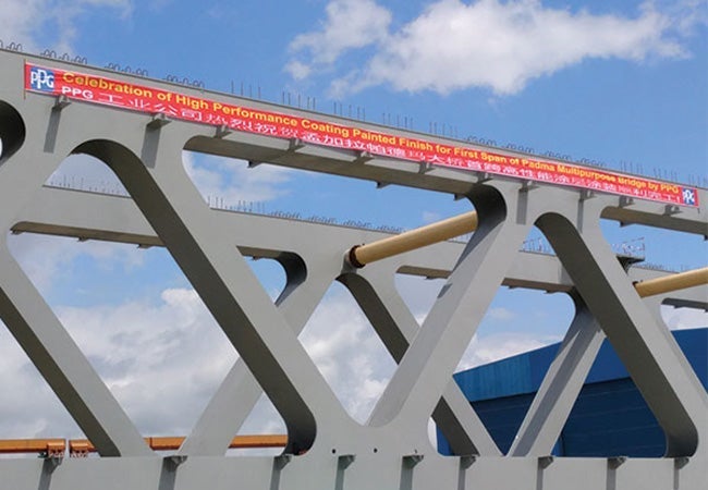 A metal bridge with a sign on it