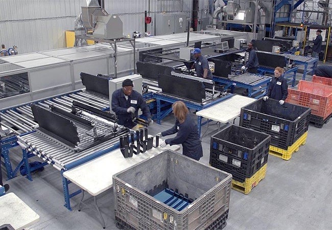 A group of people working in a factory