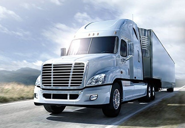 Truck driving along road