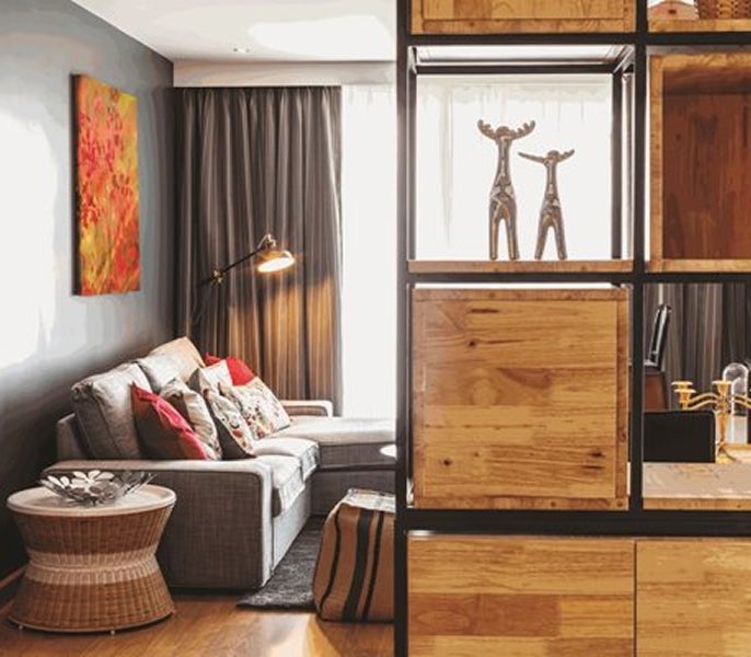 A living room with a couch and a table