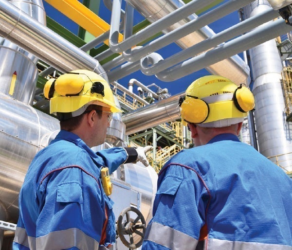 Men wearing hard hats and helmets