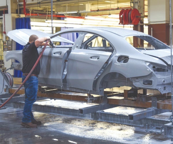 Daimler car body shell on an electrocoat line