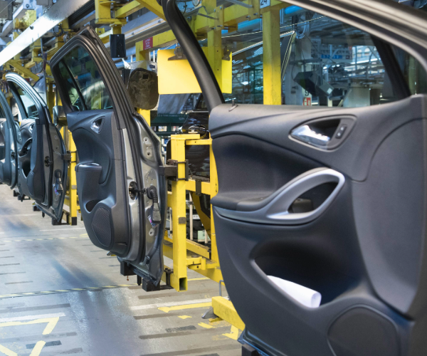 Car doors on a production line showing the inside of the door