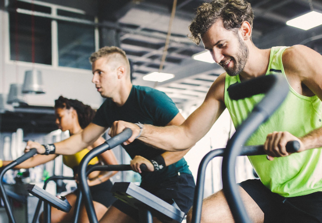 People exercising on equipment