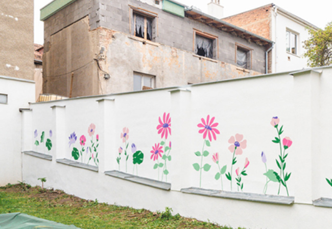 mural of flowers on a white wall