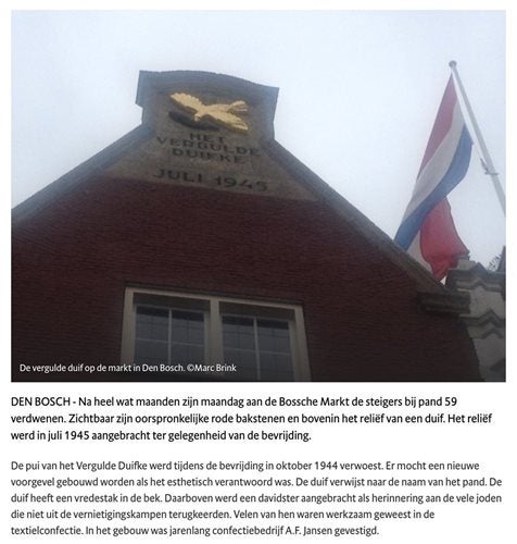 Een gebouw met een vlag en een vlag bovenop