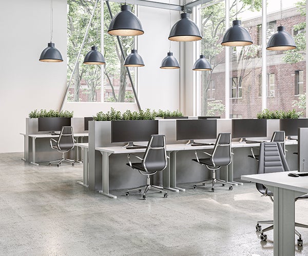 Modern office with desks containing large computer monitors