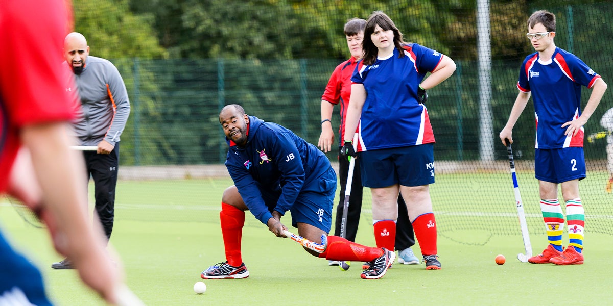 Men and Women playing hockey - Flyerz