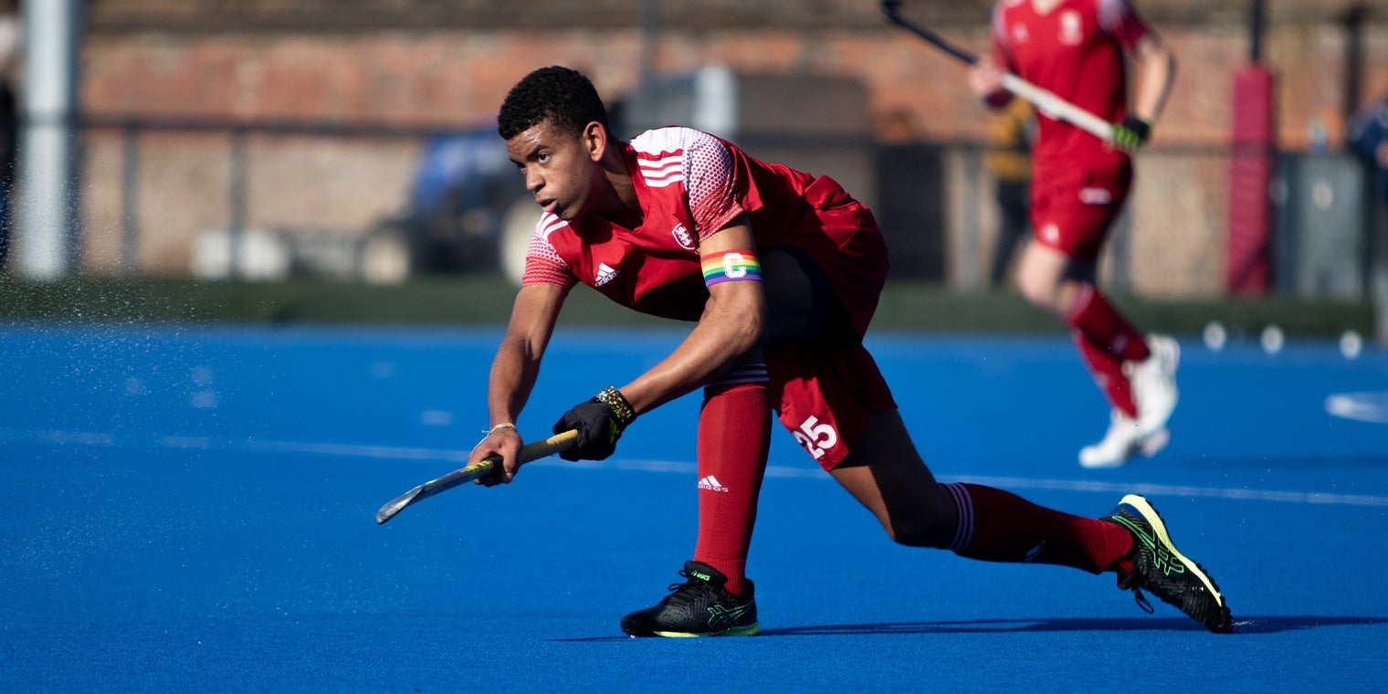 U16 Mens England Hockey Captain passing the ball