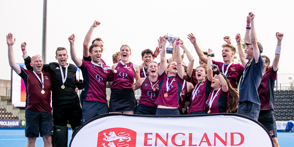 mixed hockey teams celebrating win