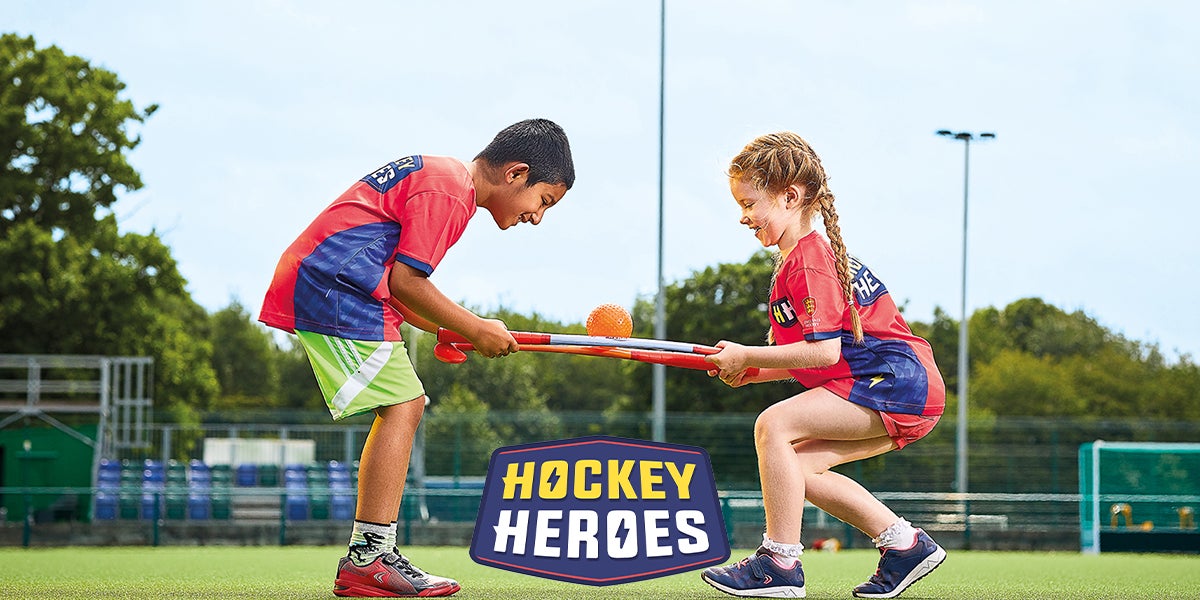 Hockey Heroes - two children, a boy and a girl, playing hockey 