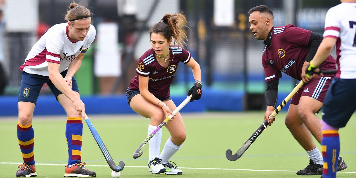 Men and Women playing hockey together at Mixed Champs finals 