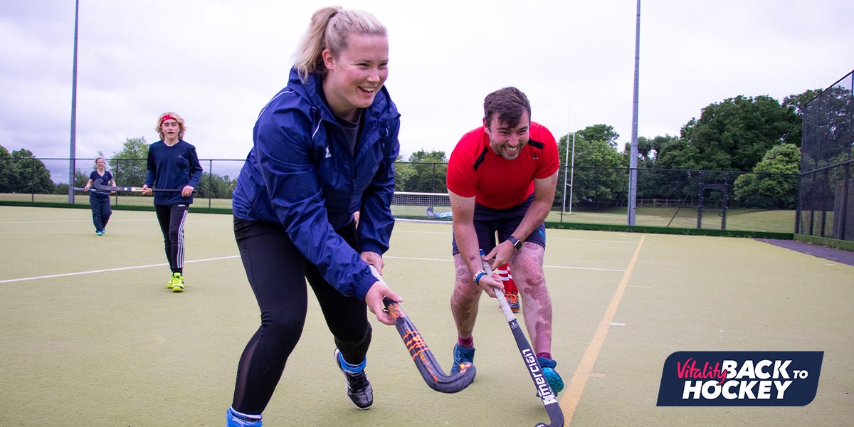 Male and Female players doing back to hockey