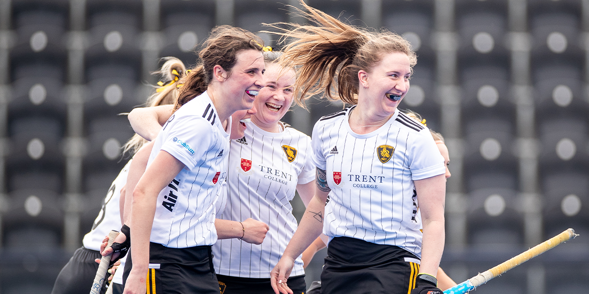 Female Hockey Players Celebrating Goal