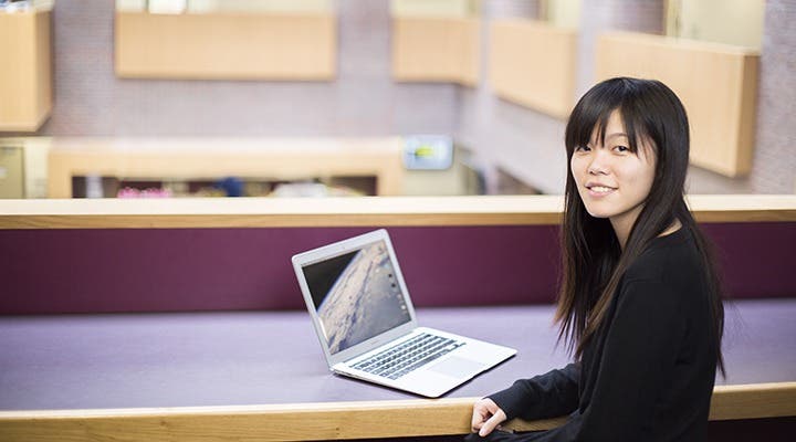 Kingston University international student on her laptop