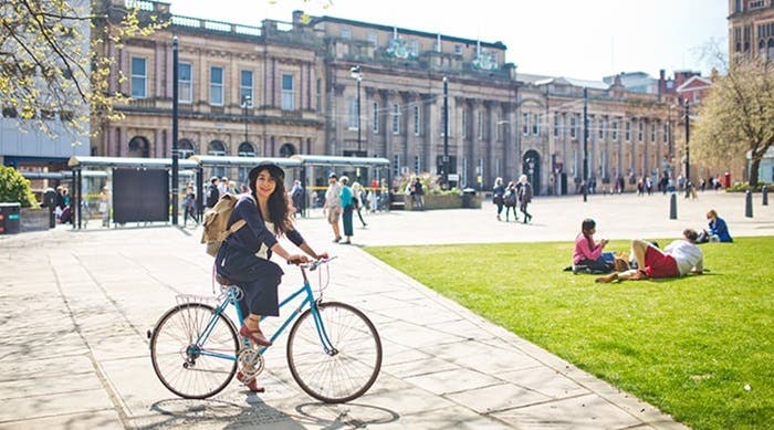 Student riding a bicycle in Sheffield