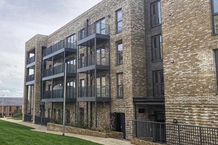 Outside a block of flats at Borders Lane development