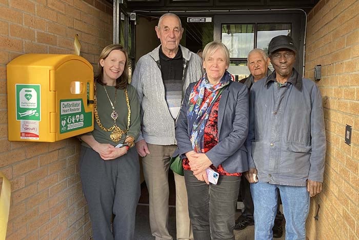 Left to right The Mayor of Hertford Vicky Smith, Clive Williams ( the tenant whose idea the Defib was), Councillor Rachel Carter, Ted Heath (tenant), Alexander Leone (tenant)