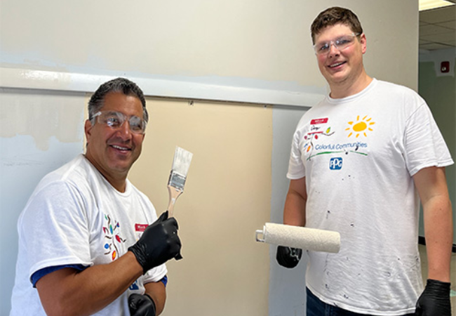 two men painting wall white in Mars, Pennsylvania 