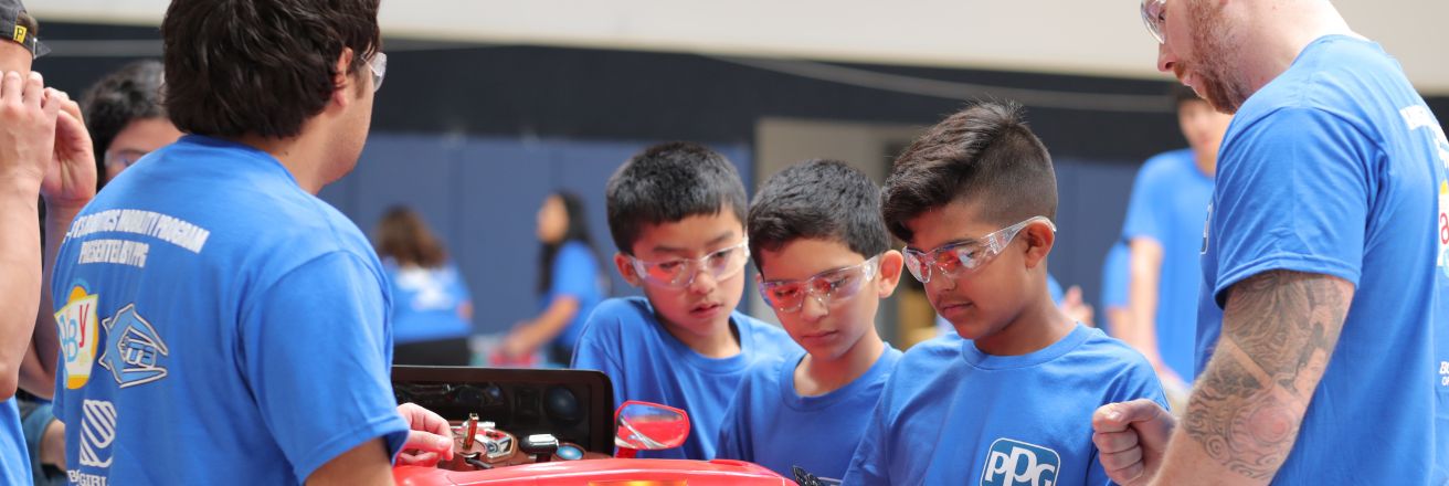 students viewing car model