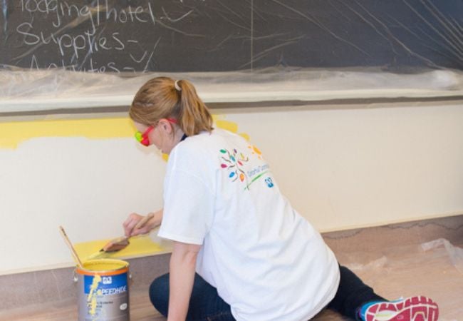 woman painting interior wall in Pittsburgh, Pennsylvania 