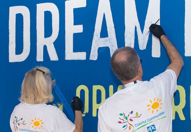 volunteers painting mural in West Palm Beach 