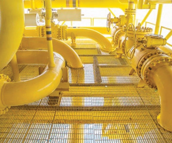 Industrial pipework coated with yellow paint