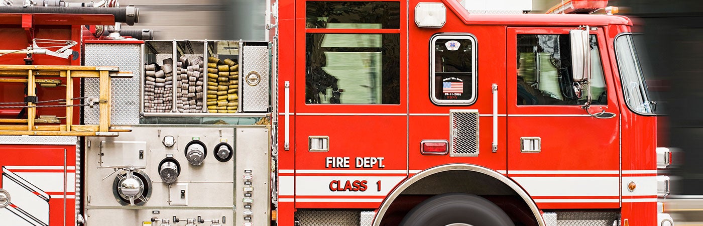 Side view of fire truck, showing bright red paint work