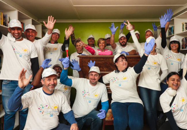 group of people raising their hands