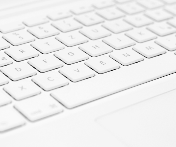 White keyboard focusing on letter tiles