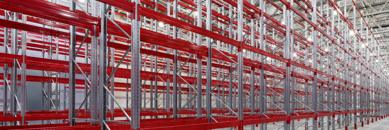 A line of red and silver metal shelving and racking