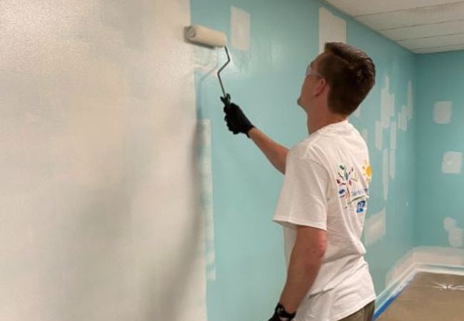 man painting interior wall in Huntsville, Alabama 