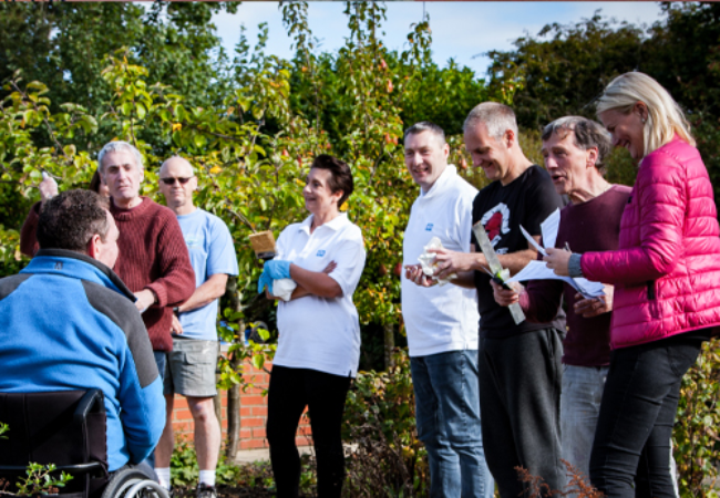 People charismatically talking to a man in Shildon, UK 