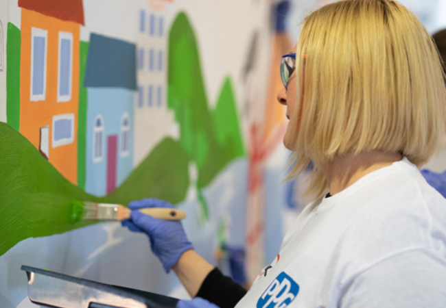 girl painting mural 