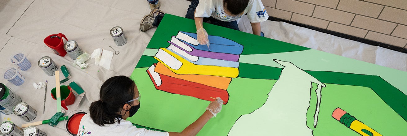 volunteers transforming schools with murals 