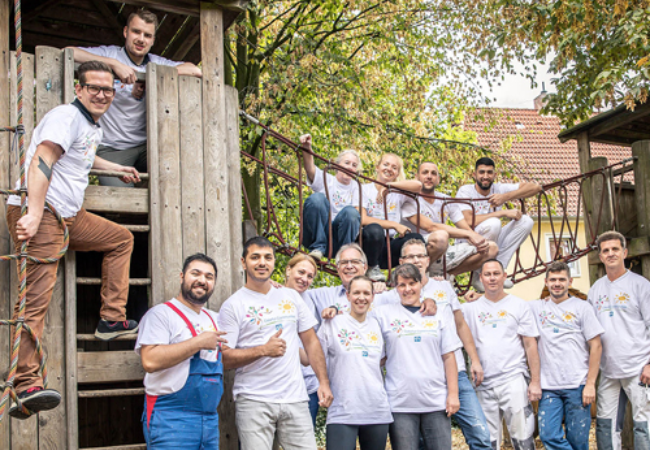 group of volunteers by jungle gym 