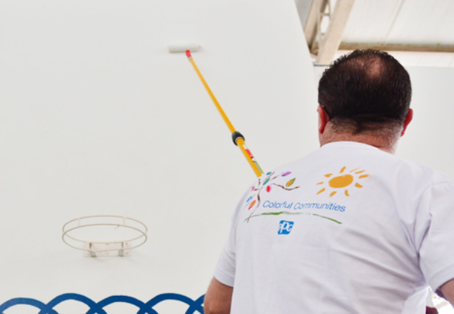 man painting wall white in Porto Alegra, Brazil 