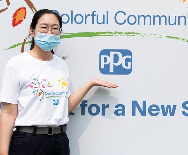 woman pointing at banner