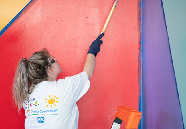 girl painting colorful mural in Cleveland, Ohio