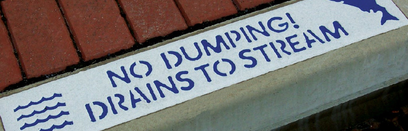 Sign that says 'No dumping, drains to stream'