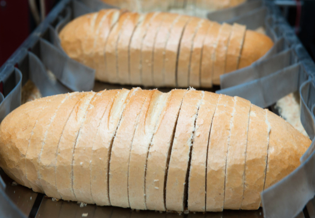 Bread cooling on a powder coated bread baking sheet.