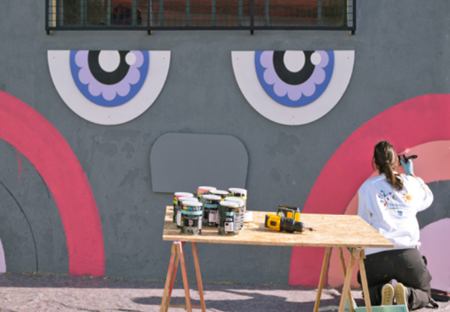 girl painting mural 